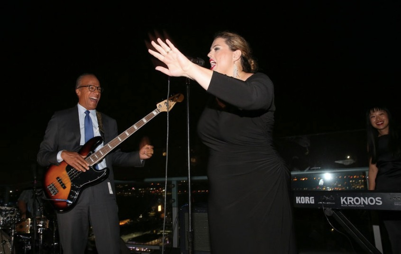 Lester Holt plays bass with his band, the 30 Rockers, at the "Dateline" 25th anniversary party Tuesday on a Manhattan rooftop. (Credit: Jemal Countess/NBC)